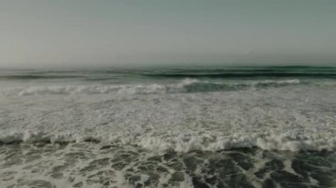 fishing on the ocean shore with fishing rod
