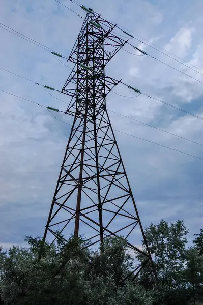power line support with high voltage wire lines against the sky view