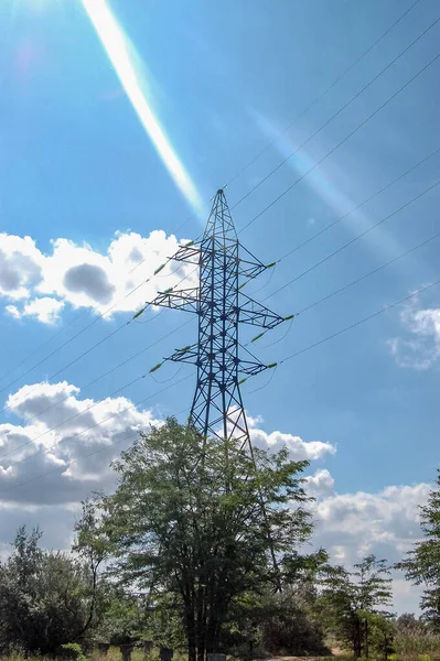 power line support with high voltage wire lines against the sky view