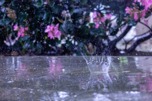 Raining on wet concrete floor