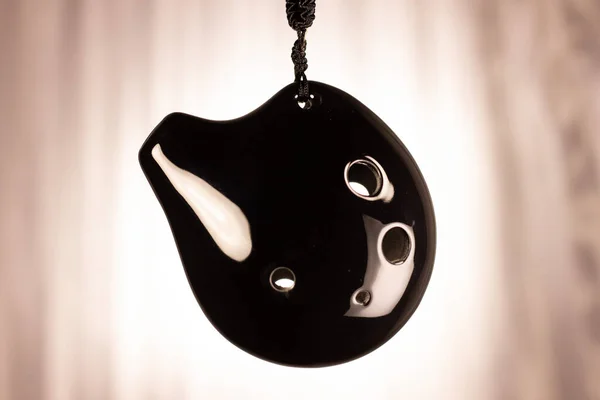 Ocarina being displayed on string