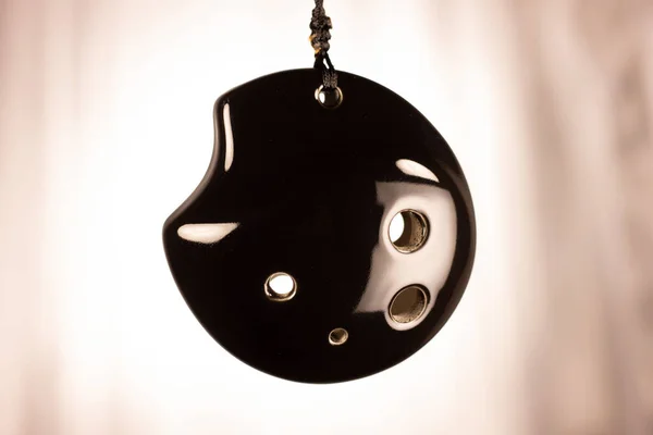 Ocarina being displayed on string