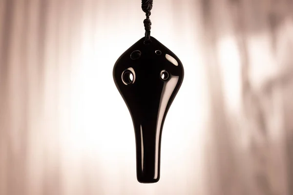 Ocarina being displayed on string