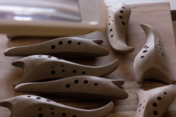A bunch of ocarinas being prepared