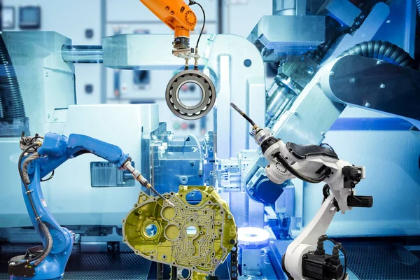 Endüstriyel otomasyon robot takım çalışması akıllı fabrika, makine mavisi renk arkaplan, endüstri 4.0 ve yapay zeka, insan yerine robot işi gelecekteki konsept üzerine