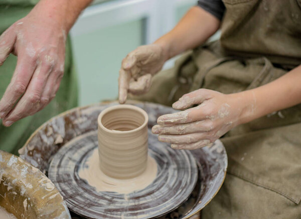 Modeling by hand. Potter's wheel. Pottery workshop