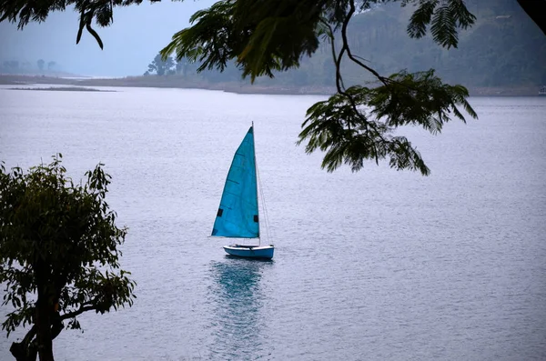The landscape of a sailing yacht in the lake. Point of view of sailing yacht and mountains