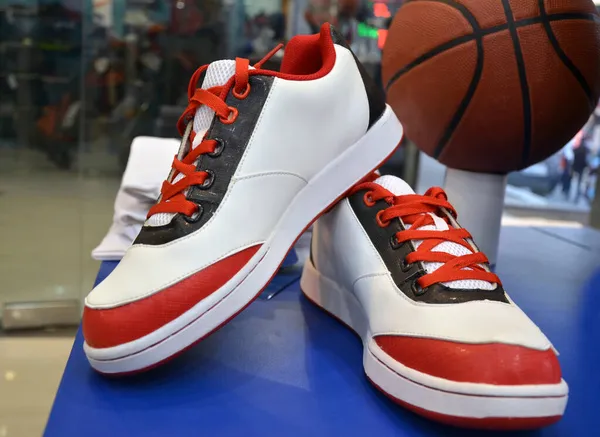 Fancy sneakers shoes are displayed to grab customers and increase sales. Pair of sneaker shoes for men and women.