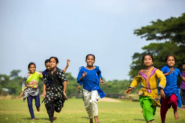 Gowainghat, Bangladesh - November 06, 2019: Selective focus on the schoolgirl running to win the athlete organized by school committee. Schoolgirls participated in running races competitions. Speed races to reach a goal.
