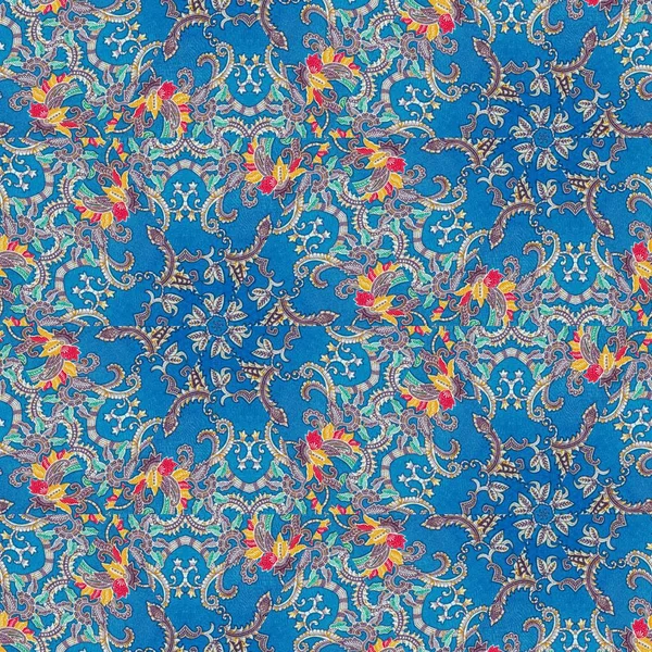 Abstract symmetrical pattern of Indonesian batik in blue, batik pattern, Image with mirror effect, Kaleidoscope of abstract pattern.