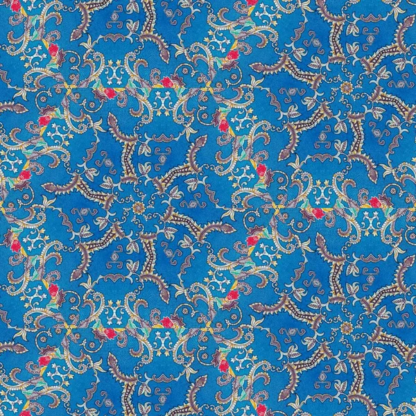 Abstract symmetrical pattern of Indonesian batik in blue, batik pattern, Image with mirror effect, Kaleidoscope of abstract pattern.