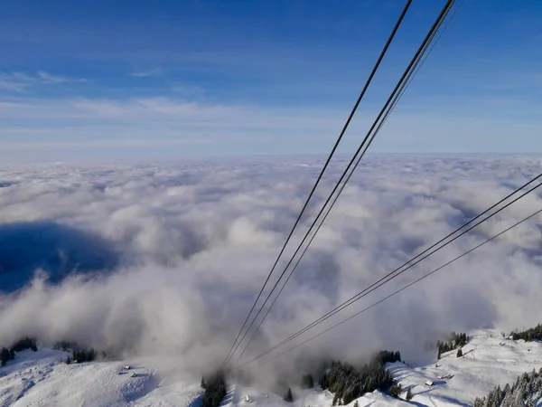 View from Hoher Kasten cable car cabin down to foggy Alpstein mountains and Appenzell. Switzerland. — Foto Stock