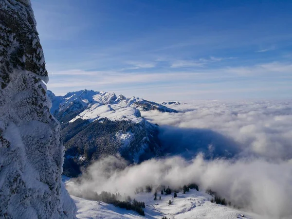 Spectacular view from Hoher Kasten cable car cabin down to foggy Alpstein mountains and Appenzell. Switzerland. — Stockfoto