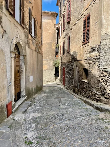 Typical Corsican stone houses in Cervione, a dreamy village nestled in the mountains of Castagniccia. Corsica, France. Vertical. — Stock Fotó
