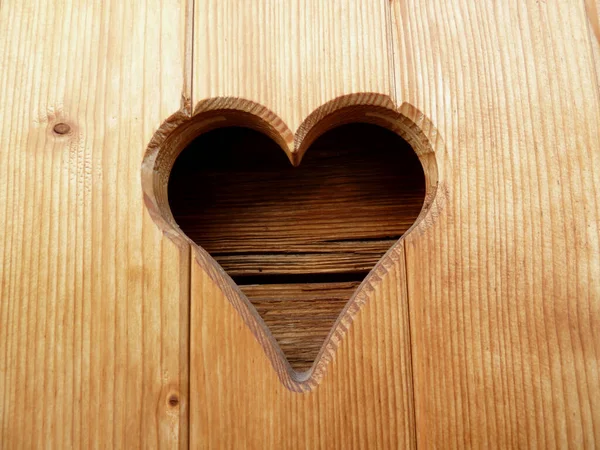 Closeup of heart in wooden shutter. Austria. — ストック写真