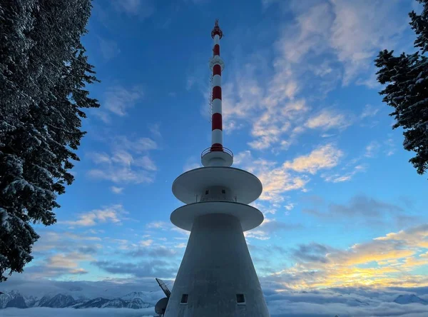 Telecommunication tower on mountain top in snow at sunset. — 스톡 사진