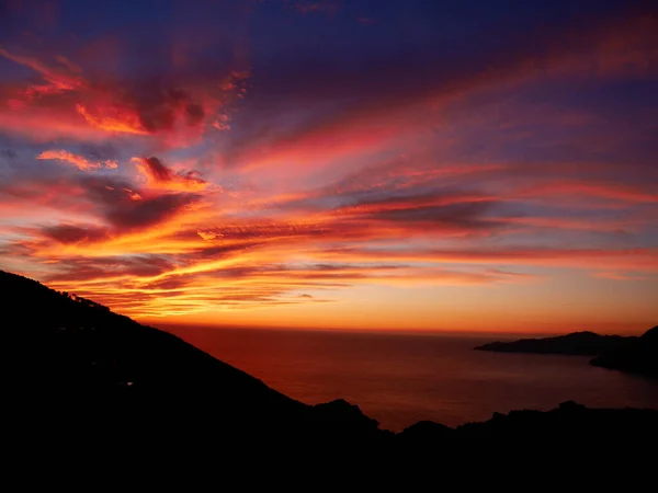 Dramatic sunset at the Calanche de Piana, UNESCO world heritage site. Corsica, France. — стокове фото