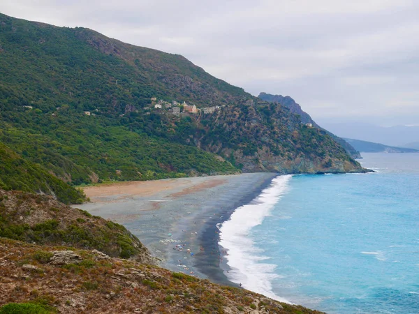 Black pebble beach of Nonza, Corsica, France. — Fotografia de Stock