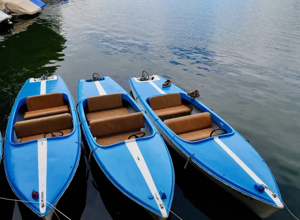 Blue canoes in Bregenz harbor, Lake of Constance. Vorarlberg, Austria. — Stockfoto