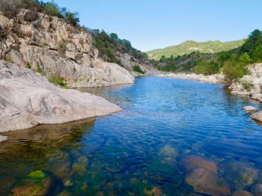 Big deep pool for swimming in river Solenzara at the foot of Bavella peaks in Southern Corsica, France. High quality photo