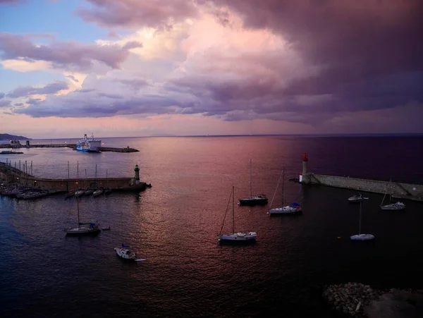  Bastia, Corsica, 17.07.2020. Old harbor of Bastia seen from the citadel at sunset. Corsica, France.