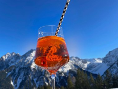 Apres-ski cocktail, after ski, in Austrian Alps. Vorarlberg, Austria.