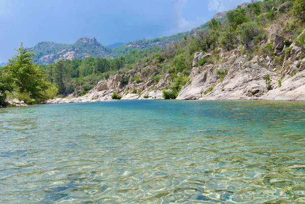 River Solenzara with turquoise water at the foot of Bavella peaks in Southern Corsica, France. — Stockfoto