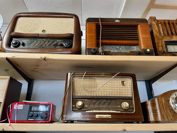 Old vintage radios in antique store. Dornbirn, Austria, 1.04.2022. High quality photo