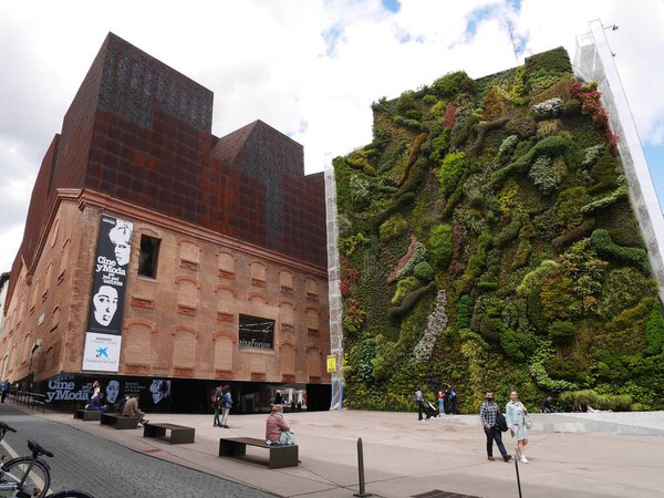 Madrid, Spain, 12.04.2022. Vertical garden and CaixaForum, a museum and cultural center in Paseo del Prado. High quality photo