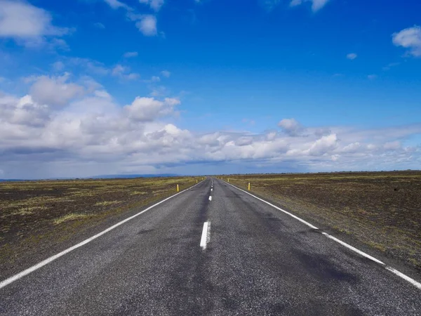 Ring Road passing through barren lava field in Southern Iceland. High quality photo