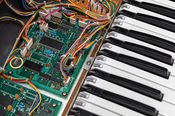 View of an electronic circuit repair board and its components of an electric piano. Concept repair, electronic