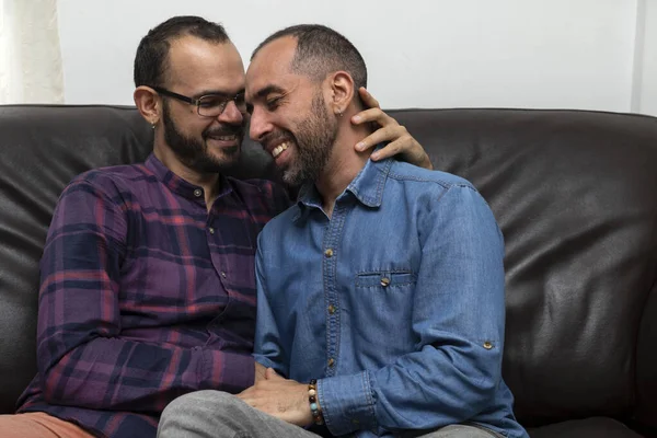 Real couple of Latin American men smile and feel in love. Concept of sexual diversity