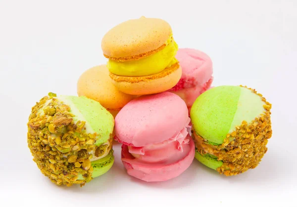 French macaroons on a white background.  French dessert. Sweet table. Copy space. Place for text.