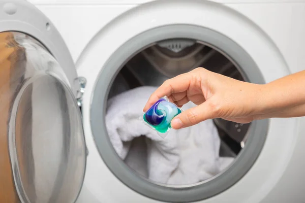 Woman Putting Laundry Detergent Capsule Washing Machine Indoors Closeup Colorful — Stock Photo, Image