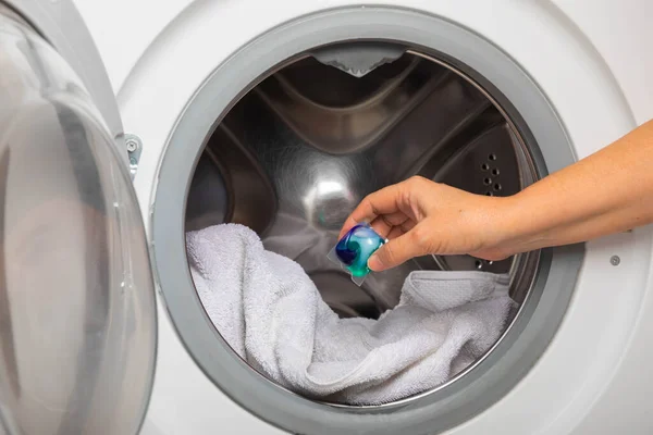 Woman Putting Laundry Detergent Capsule Washing Machine Indoors Closeup Colorful — Stock Photo, Image