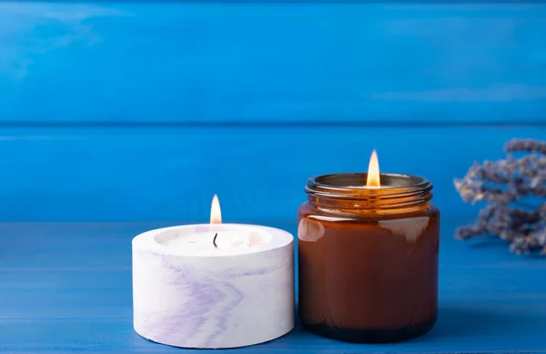 Cozy Burning Candle Brown Glass Jar Concrete Planter Blue Wood — ストック写真