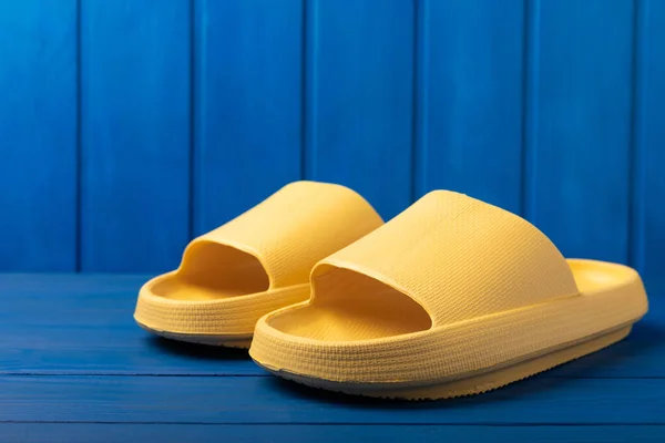 Stylish Rubber Yellow Slippers Blue Texture Background Changeable Shoes Beach — 스톡 사진