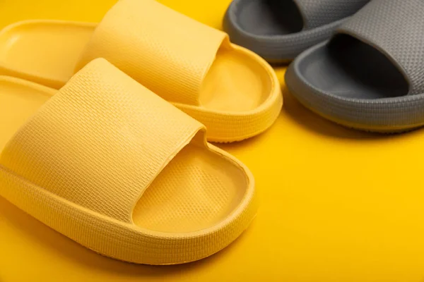 Pair Stylish Rubber Slippers Yellow Background Changeable Shoes Beach Shoes — 스톡 사진