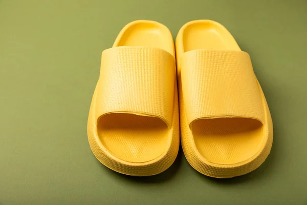 Stylish Rubber Yellow Slippers Green Background Changeable Shoes Beach Shoes — 스톡 사진