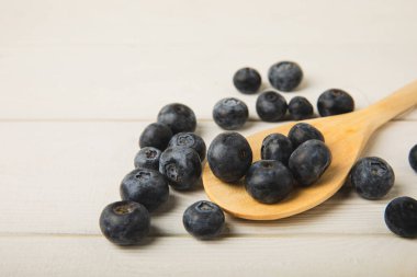 Blueberries on white textured background. Ripe and fresh blueberries. Vitamins. Healthy food. Juicy berry.Copy space.Place for text