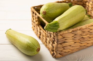 Squash vegetable marrow zucchini on white texture background.Vegetarian organic vegetables.Healthy food.Copy space.Place for text.Healthy food concept.