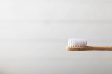 Toothbrushes. Oral care. Dental care. Composition with bamboo toothbrushes on a light background. Eco friendly.Copy space. Place for text.Fletley
