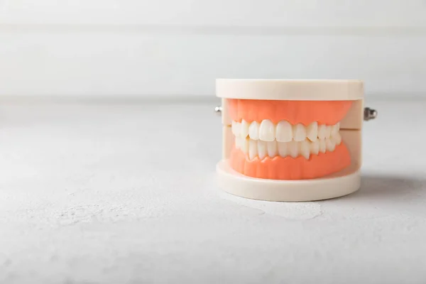 Dentures on a white background. Upper and lower jaws with false teeth. Dentures or false teeth, close-up. copy space.Dentist concept.MOCKUP