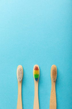 Toothbrushes. Oral care. Dental care. Composition with bamboo toothbrushes on a yellow background. Eco friendly.Copy space. Place for text.Fletley