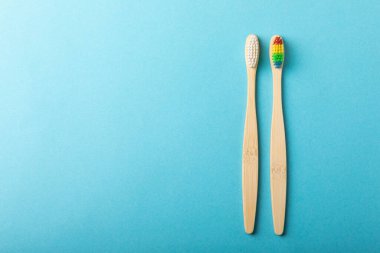 Toothbrushes. Oral care. Dental care. Composition with bamboo toothbrushes on a yellow background. Eco friendly.Copy space. Place for text.Fletley