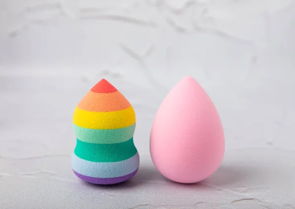 Beauty blender.Colorful beauty sponges on white marble background. Cosmetic tool for applying and blending products such as foundation and concealer. Copy space. place for text.