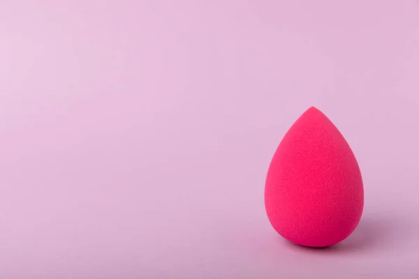 Beauty blender.Colorful beauty sponges on lilac background. Cosmetic tool for applying and blending products such as foundation and concealer. Copy space. place for text.