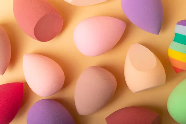 Beauty blender.Colorful beauty sponges on a beige background. Cosmetic tool for applying and blending products such as foundation and concealer. Copy space. place for text.