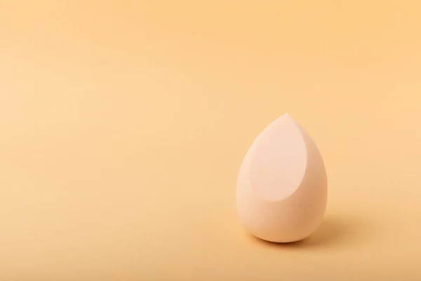 Beauty blender.Colorful beauty sponges on a beige background. Cosmetic tool for applying and blending products such as foundation and concealer. Copy space. place for text.