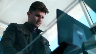 Cute hacker breaks into a system with a laptop